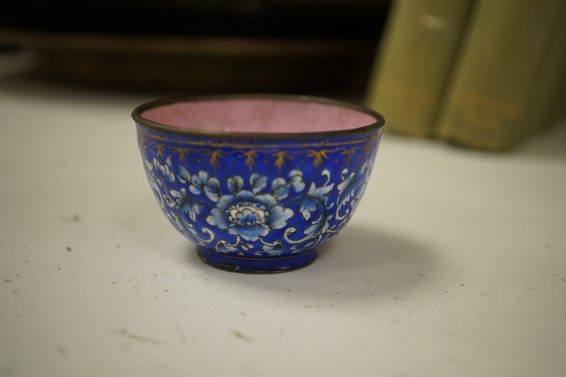 A group of Chinese blue and white porcelain, including a mid 19th century Canton enamel teabowl and a Japanese small dish, tallest 22cm. Condition - fair